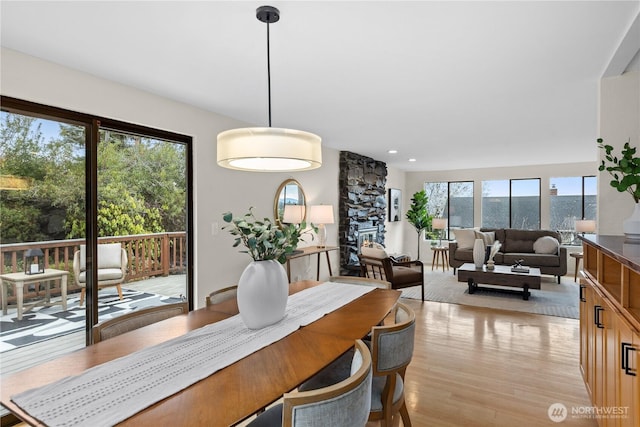 dining room with recessed lighting and light wood-type flooring