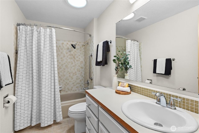 bathroom with visible vents, toilet, backsplash, shower / tub combo, and vanity