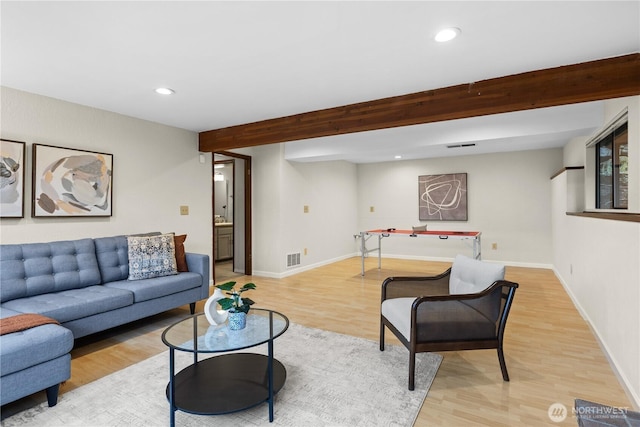 living room featuring beamed ceiling, recessed lighting, baseboards, and wood finished floors