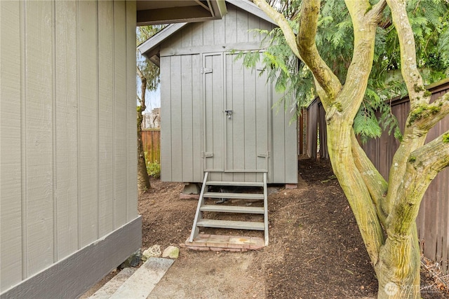 view of shed featuring a fenced backyard