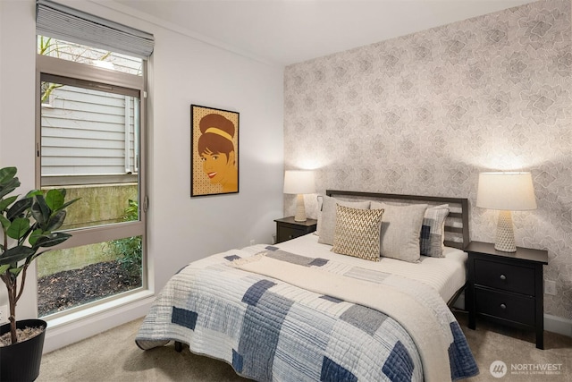 bedroom with baseboards, carpet, and wallpapered walls