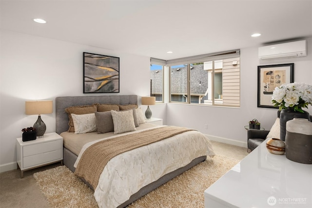 carpeted bedroom with recessed lighting, baseboards, and a wall unit AC