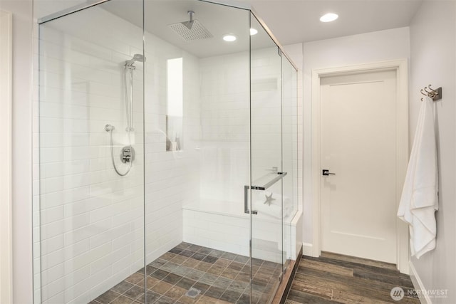 full bath featuring recessed lighting, a stall shower, and wood finished floors