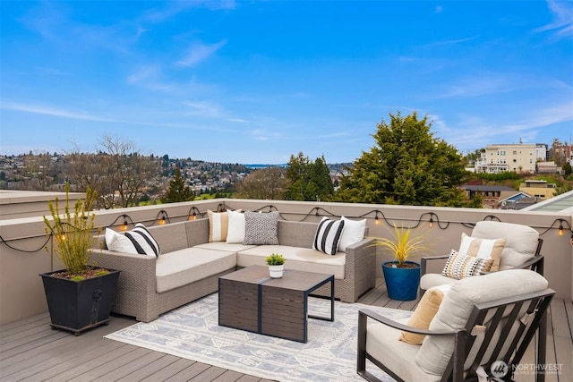 wooden deck with an outdoor living space