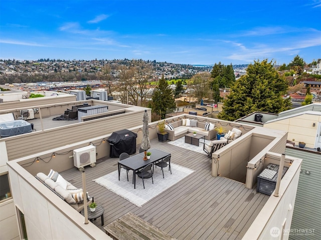 wooden deck featuring area for grilling, outdoor dining space, outdoor lounge area, and a wall mounted AC