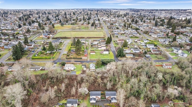 birds eye view of property with a residential view