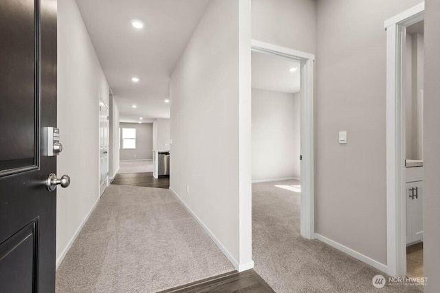 corridor featuring recessed lighting, baseboards, and carpet floors