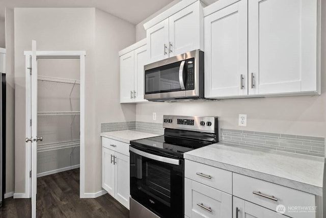 kitchen featuring white cabinetry, light countertops, and stainless steel appliances