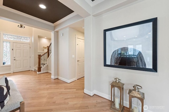 entryway with recessed lighting, stairway, baseboards, and light wood-style flooring