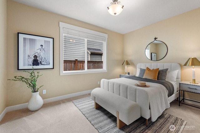 carpeted bedroom featuring baseboards