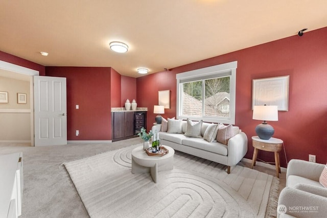 living room featuring baseboards and carpet floors