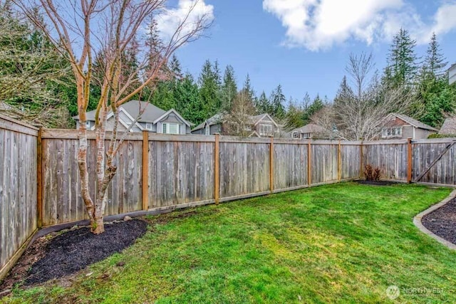 view of yard featuring a fenced backyard