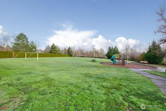 view of yard featuring playground community