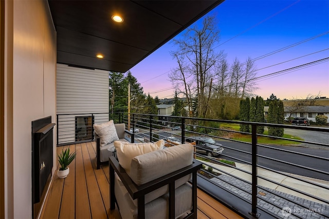 view of balcony at dusk