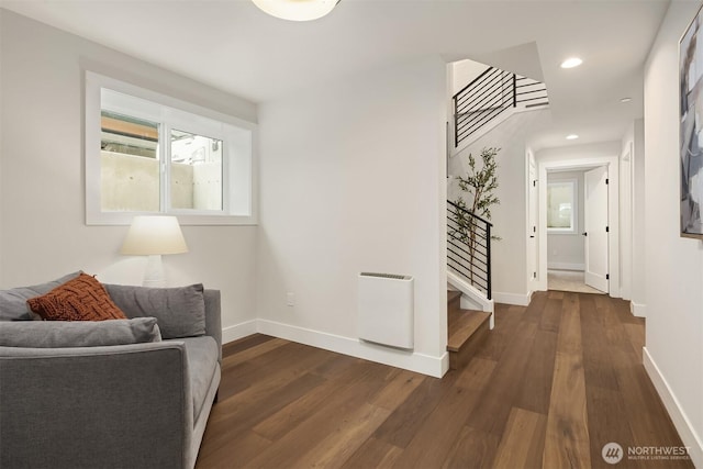 interior space with recessed lighting, baseboards, dark wood-style floors, and stairs