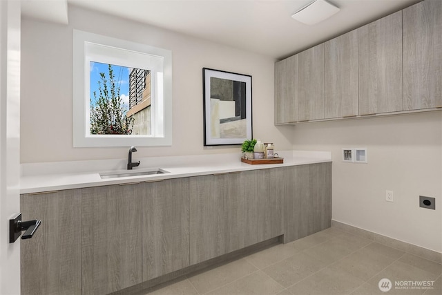 bathroom featuring tile patterned floors and a sink