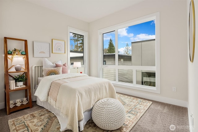 carpeted bedroom with baseboards