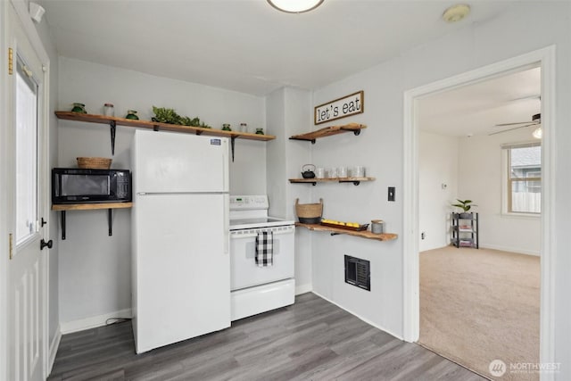 kitchen featuring visible vents, dark wood-type flooring, white appliances, a ceiling fan, and open shelves