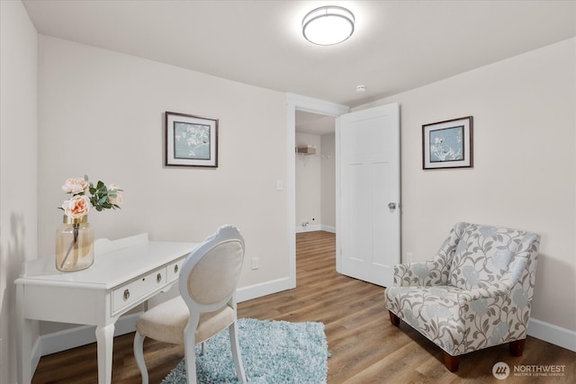 home office featuring light wood-type flooring and baseboards