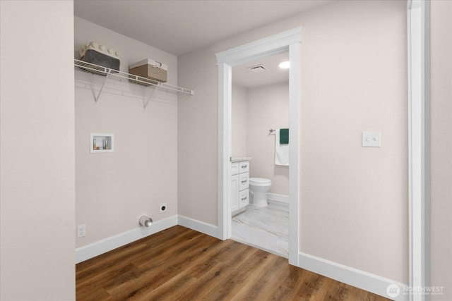 laundry room featuring visible vents, baseboards, laundry area, electric dryer hookup, and washer hookup