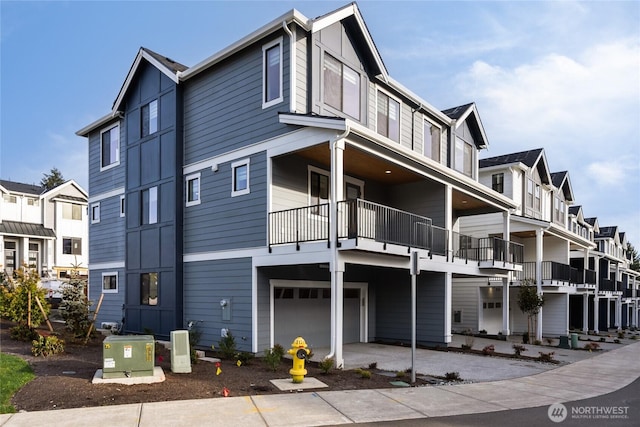 view of front of house with a residential view and an attached garage