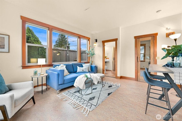 living room featuring baseboards