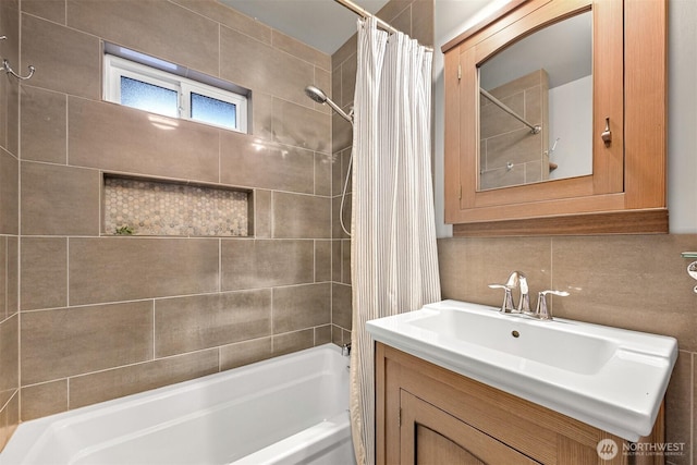 full bathroom with decorative backsplash, shower / bath combination with curtain, and vanity