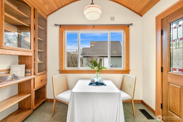 dining room featuring visible vents, wood ceiling, baseboards, and vaulted ceiling