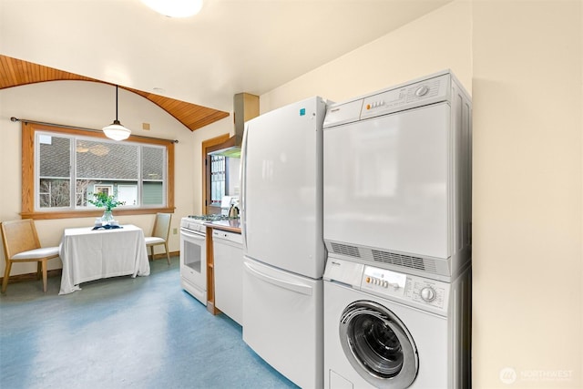 laundry area featuring stacked washer / dryer and laundry area