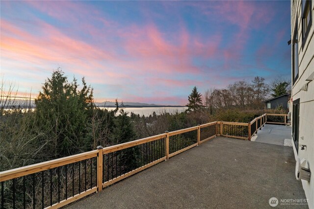 wooden deck with a patio