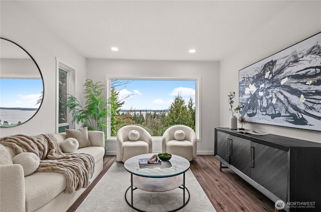 living area with recessed lighting, baseboards, and dark wood-style floors