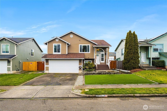 view of front of property featuring an attached garage, concrete driveway, a front lawn, and fence