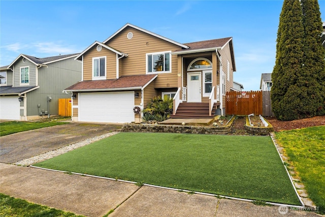 view of front of property with fence, driveway, roof with shingles, a front lawn, and a garage