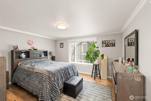 bedroom featuring ornamental molding, baseboards, and wood finished floors