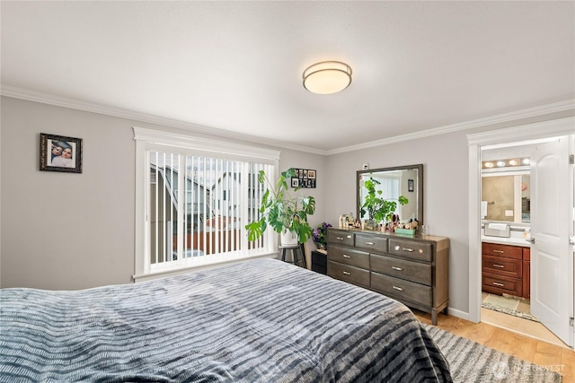 bedroom featuring light wood-style flooring, ensuite bathroom, and ornamental molding