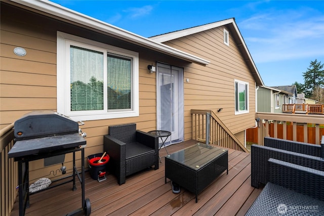 wooden terrace featuring grilling area