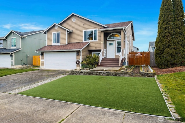 view of front of house featuring fence, concrete driveway, a front yard, roof with shingles, and a garage