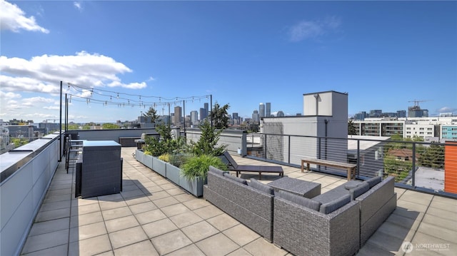 view of patio / terrace featuring a view of city and outdoor lounge area