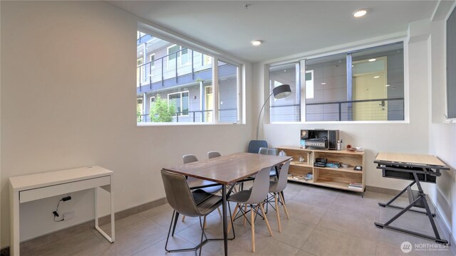 dining room featuring tile patterned flooring, recessed lighting, and baseboards