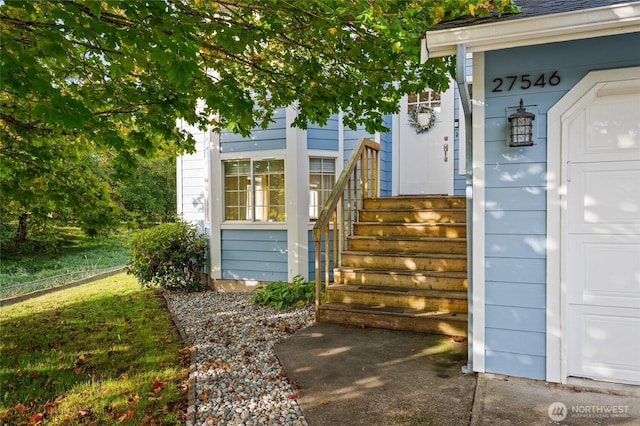 doorway to property featuring a garage