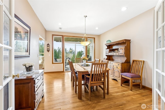 dining room featuring recessed lighting, baseboards, and light wood finished floors