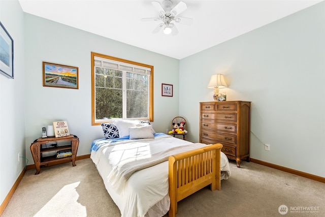 bedroom with light carpet, a ceiling fan, and baseboards