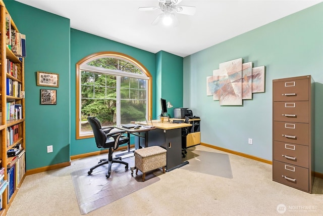 home office with light colored carpet, baseboards, and ceiling fan