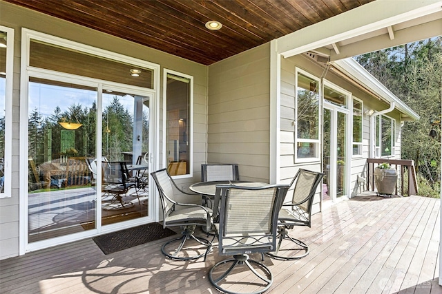 deck featuring outdoor dining area