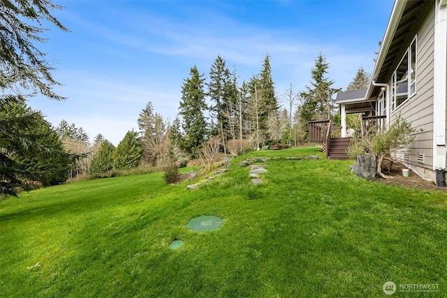 view of yard with a wooden deck