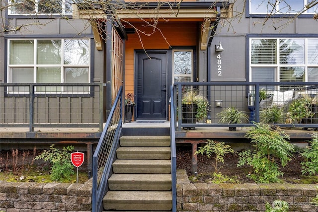 doorway to property featuring a porch