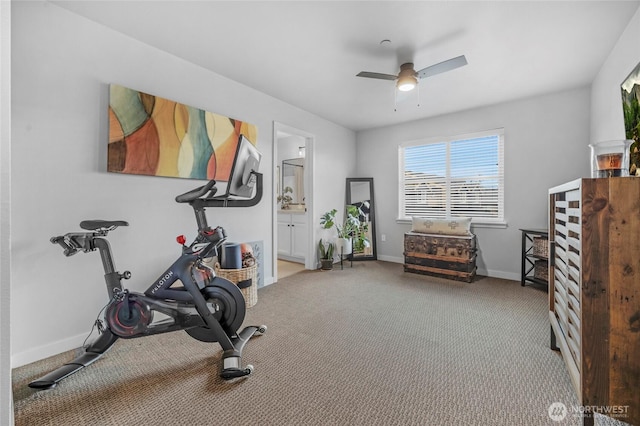 exercise room featuring baseboards, carpet, and a ceiling fan