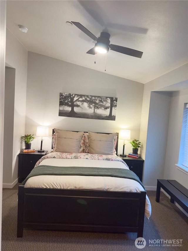 carpeted bedroom featuring a ceiling fan and baseboards