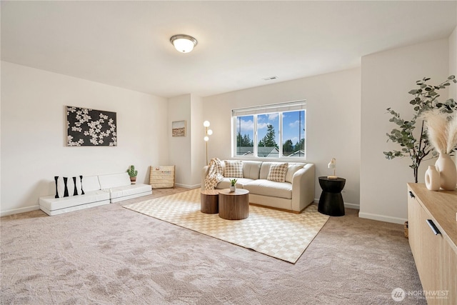 living area featuring visible vents, light colored carpet, and baseboards