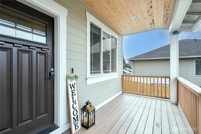 wooden terrace featuring a porch